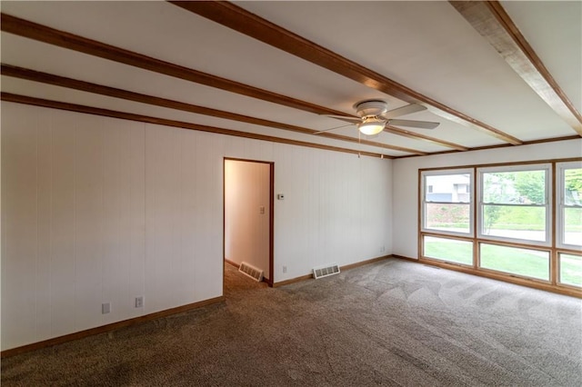 717 Y St, Atchison, KS 66002 - unfurnished room with ceiling fan, carpet, beamed ceiling, and baseboards