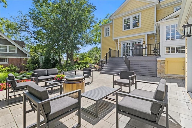 4525 Kenwood Ave, Kansas City, MO 64110 - view of patio featuring stairs and outdoor lounge area