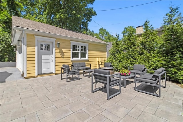 4525 Kenwood Ave, Kansas City, MO 64110 - view of patio / terrace with an outdoor structure and an outdoor hangout area