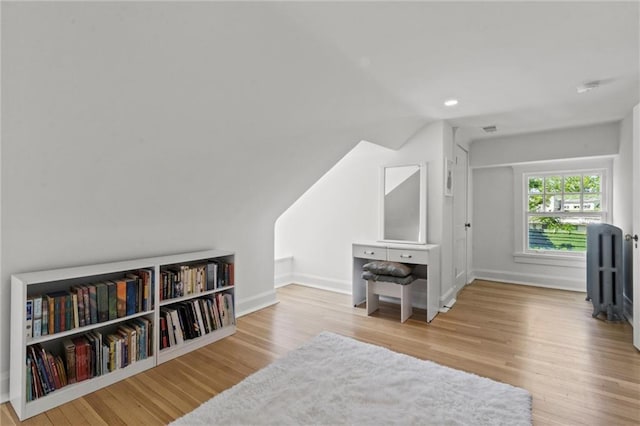 4525 Kenwood Ave, Kansas City, MO 64110 - living area with wood finished floors, baseboards, lofted ceiling, and recessed lighting