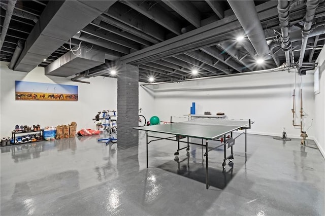 4525 Kenwood Ave, Kansas City, MO 64110 - game room with finished concrete flooring and ornate columns
