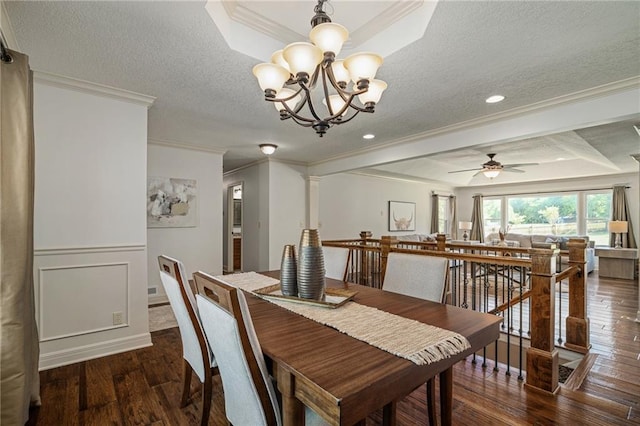 9015 Craig Dr, De Soto, KS 66018 - dining space featuring ornamental molding, wood-type flooring, a chandelier, a textured ceiling, and a ceiling fan