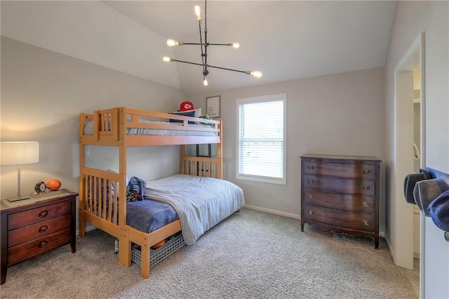 carpeted bedroom featuring baseboards, a notable chandelier, and vaulted ceiling