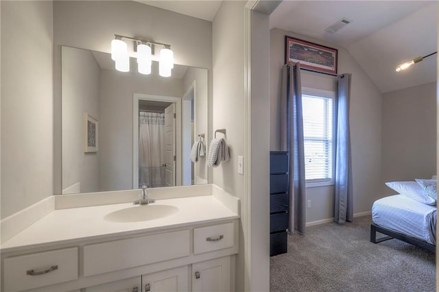 bathroom featuring connected bathroom, visible vents, baseboards, lofted ceiling, and vanity
