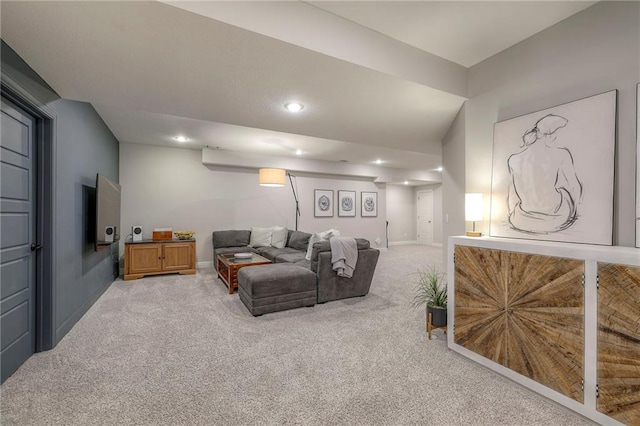 living room featuring baseboards, light carpet, and recessed lighting