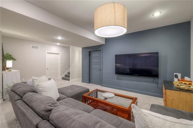 living area with carpet floors, stairway, baseboards, visible vents, and recessed lighting