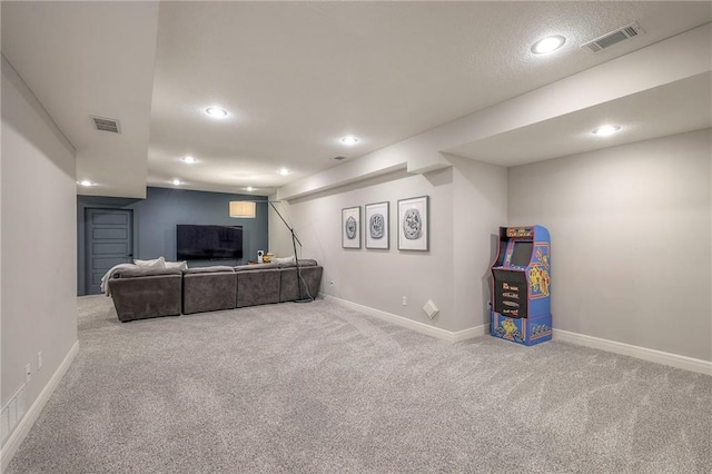 carpeted living area with visible vents, baseboards, and recessed lighting