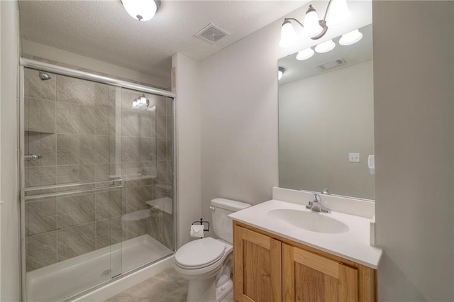 full bathroom featuring tile patterned floors, toilet, visible vents, and a shower stall