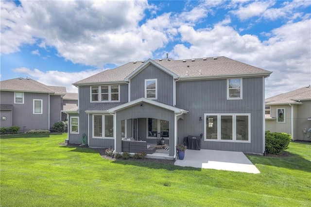 back of house with a yard and a patio area