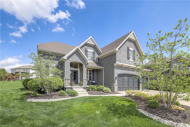 craftsman house with concrete driveway, a front yard, stucco siding, and an attached garage