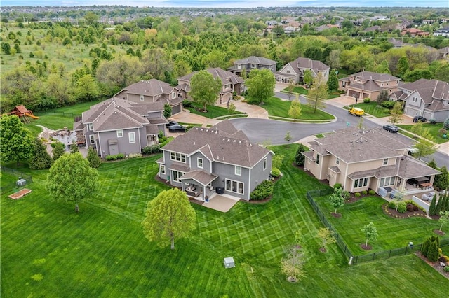 birds eye view of property with a residential view