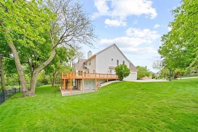 back of house with fence, a deck, stairway, a chimney, and a lawn