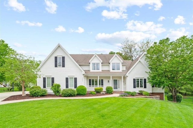 view of front of property featuring a porch and a front lawn