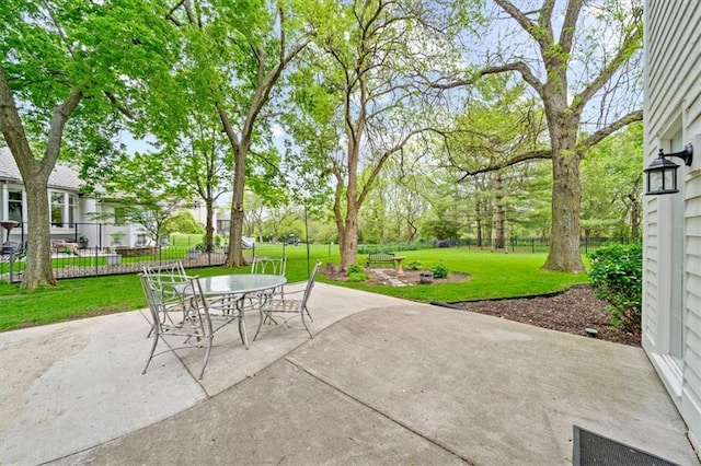 view of patio / terrace featuring outdoor dining area and fence