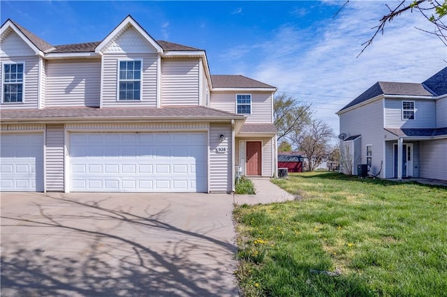 view of front of home with a garage, central AC, roof with shingles, a front yard, and driveway
