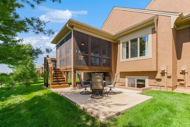 21287 W 116th St, Olathe, KS 66061 - rear view of house with a patio, stucco siding, a sunroom, a lawn, and stairway