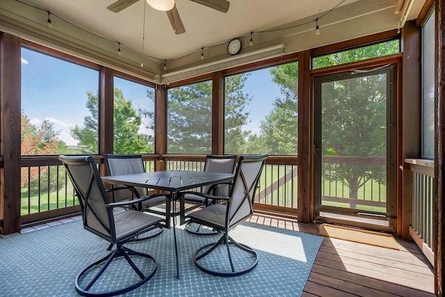 21287 W 116th St, Olathe, KS 66061 - sunroom / solarium featuring a ceiling fan, outdoor dining area, and plenty of natural light