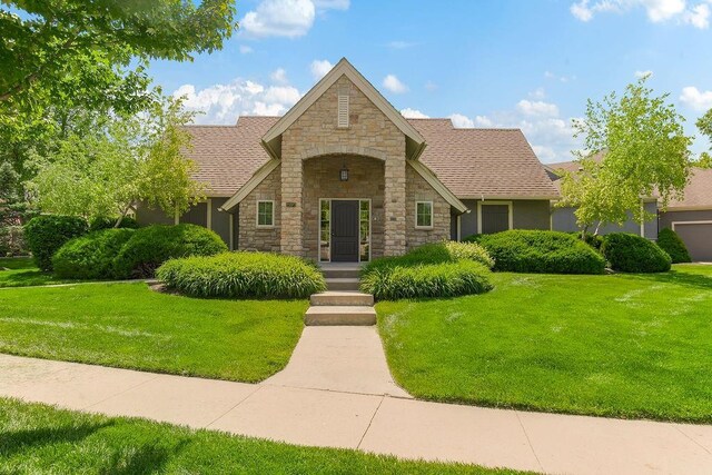 21287 W 116th St, Olathe, KS 66061 - view of front of house with stone siding, a front lawn, and a shingled roof
