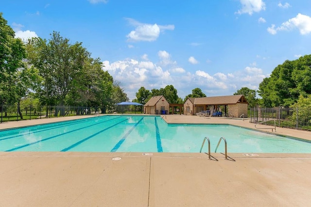 21287 W 116th St, Olathe, KS 66061 - community pool with fence, a patio area, and view of scattered trees
