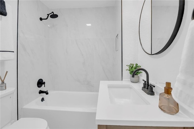 bathroom with vanity, shower / bathing tub combination, and toilet