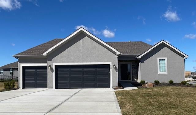 18804 Redbud Ln, Spring Hill, KS 66083 - ranch-style house with an attached garage, stucco siding, concrete driveway, and a front lawn