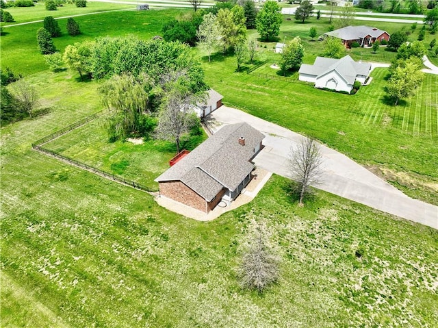 birds eye view of property with a rural view