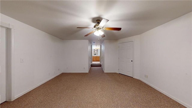 unfurnished room featuring ceiling fan, baseboards, and carpet flooring