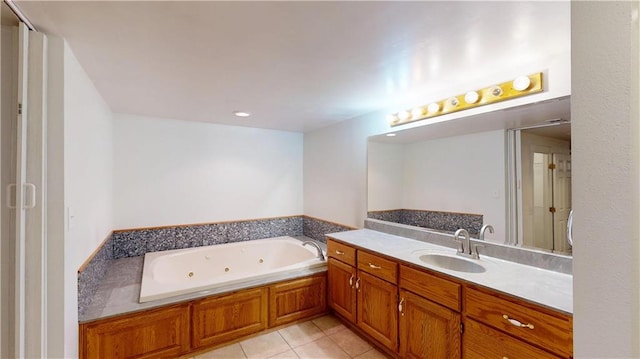 full bathroom featuring a jetted tub, recessed lighting, tile patterned flooring, and vanity