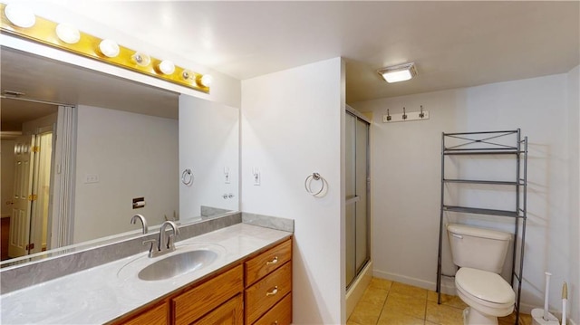 full bath featuring vanity, toilet, a stall shower, baseboards, and tile patterned flooring
