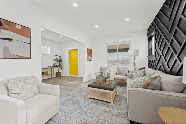 3232 Woodland Ave, Kansas City, MO 64109 - living area with baseboards, recessed lighting, and wood finished floors