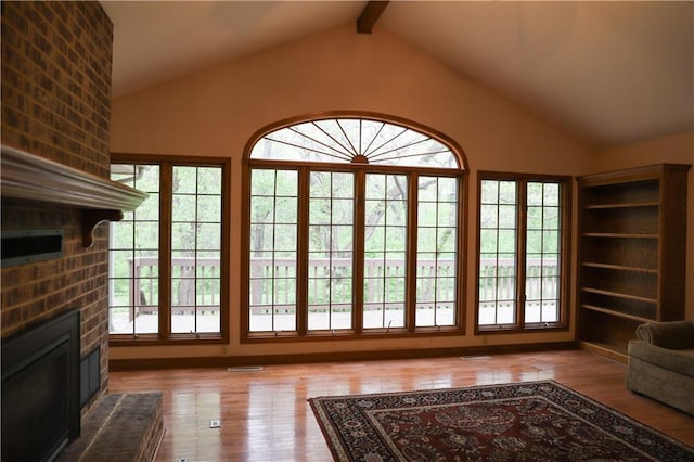 1203 E Quincy St, Pittsburg, KS 66762 - entryway with hardwood / wood-style flooring, lofted ceiling with beams, and a healthy amount of sunlight