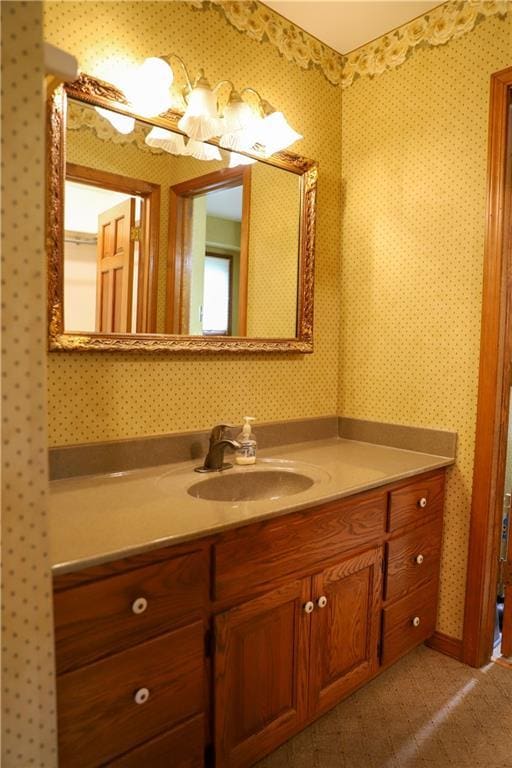 1203 E Quincy St, Pittsburg, KS 66762 - bathroom with wallpapered walls and vanity