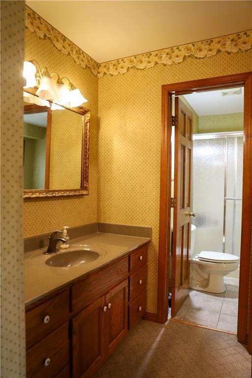 1203 E Quincy St, Pittsburg, KS 66762 - full bathroom featuring vanity, an enclosed shower, and toilet