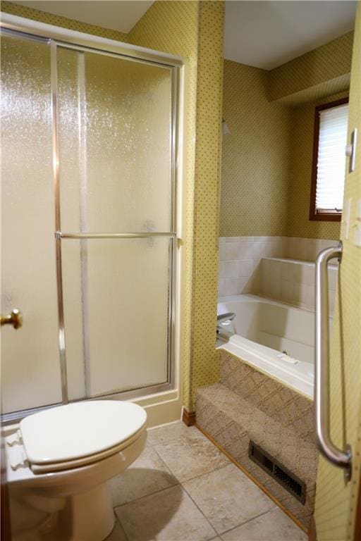 1203 E Quincy St, Pittsburg, KS 66762 - full bathroom with a shower stall, a garden tub, wallpapered walls, toilet, and visible vents