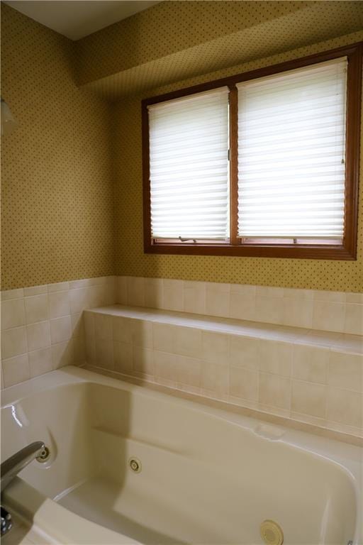 1203 E Quincy St, Pittsburg, KS 66762 - bathroom with wallpapered walls and a jetted tub