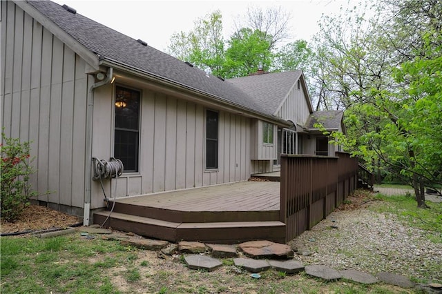 1203 E Quincy St, Pittsburg, KS 66762 - view of home's exterior with a wooden deck and a shingled roof
