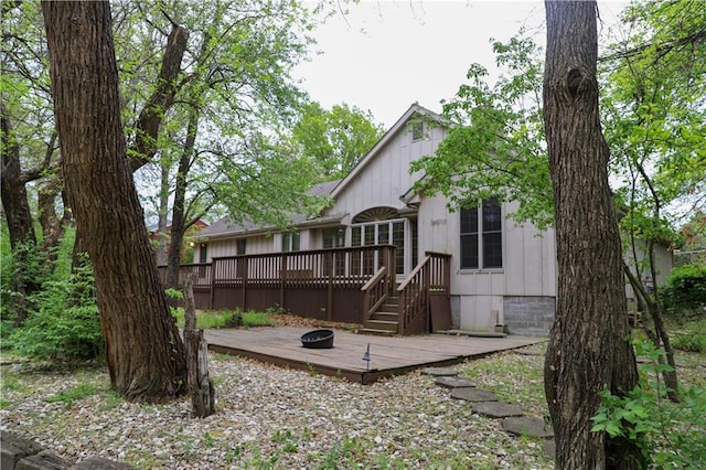 1203 E Quincy St, Pittsburg, KS 66762 - rear view of house featuring a wooden deck and crawl space