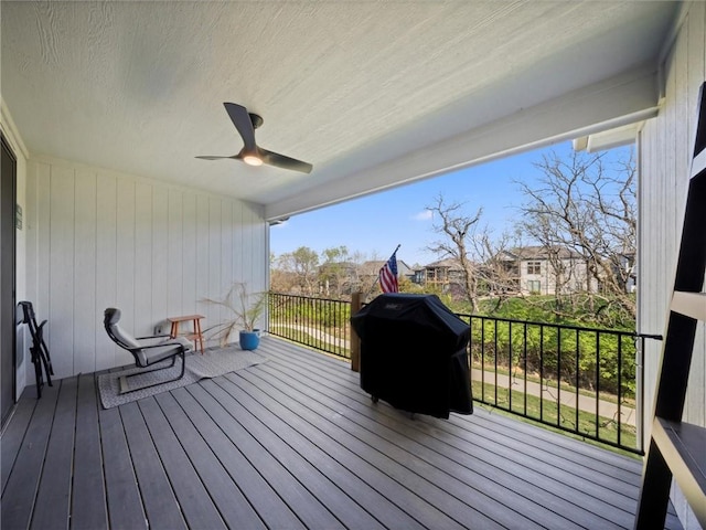 deck with a ceiling fan and a grill