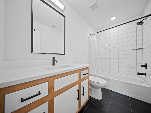 bathroom featuring visible vents, vanity, shower / bath combination with curtain, toilet, and tile patterned floors