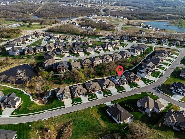bird's eye view with a residential view and a water view