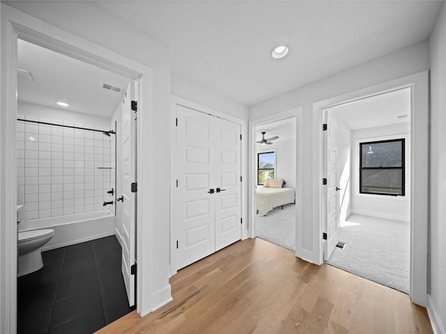 22615 W 87th Ter, Lenexa, KS 66227 - hall featuring wood finished floors and recessed lighting