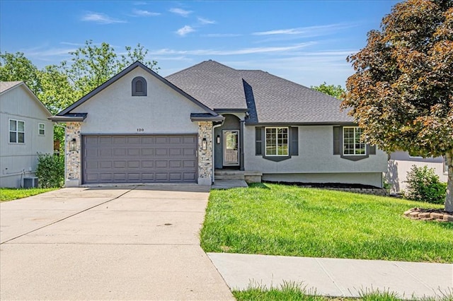 120 NW Whitlock Dr, Lees Summit, MO 64081 - view of front facade with an attached garage, a front lawn, driveway, stucco siding, and central AC unit