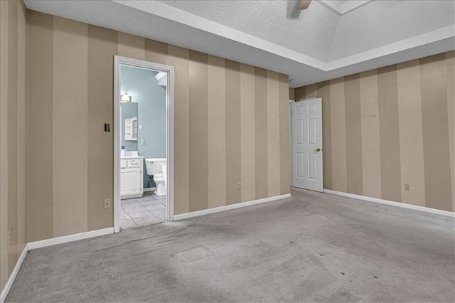 120 NW Whitlock Dr, Lees Summit, MO 64081 - carpeted spare room with baseboards, ceiling fan, and a textured ceiling