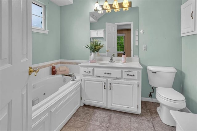 120 NW Whitlock Dr, Lees Summit, MO 64081 - bathroom featuring toilet, a jetted tub, vanity, a chandelier, and tile patterned flooring