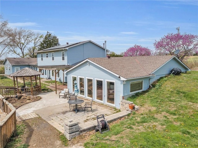 24101 S State Route K, Pleasant Hill, MO 64080 - rear view of property featuring a gazebo, a lawn, a patio area, and roof with shingles