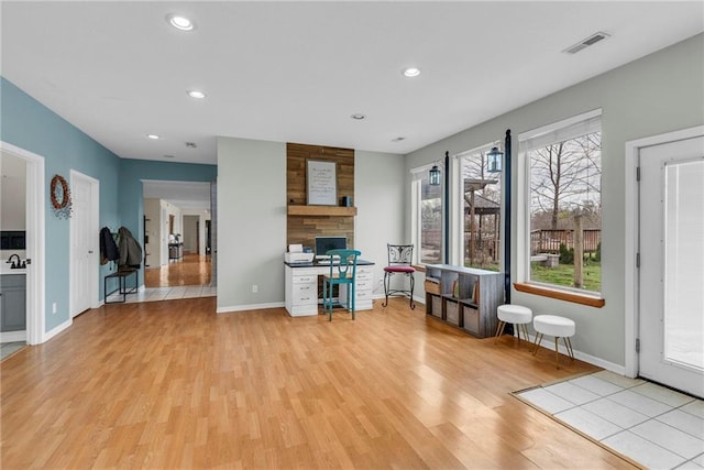 24101 S State Route K, Pleasant Hill, MO 64080 - living room featuring light wood finished floors, baseboards, recessed lighting, and a stone fireplace