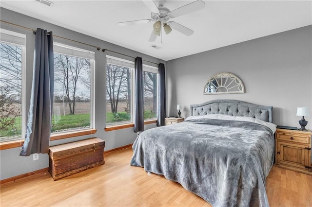 24101 S State Route K, Pleasant Hill, MO 64080 - bedroom featuring wood finished floors, baseboards, and ceiling fan