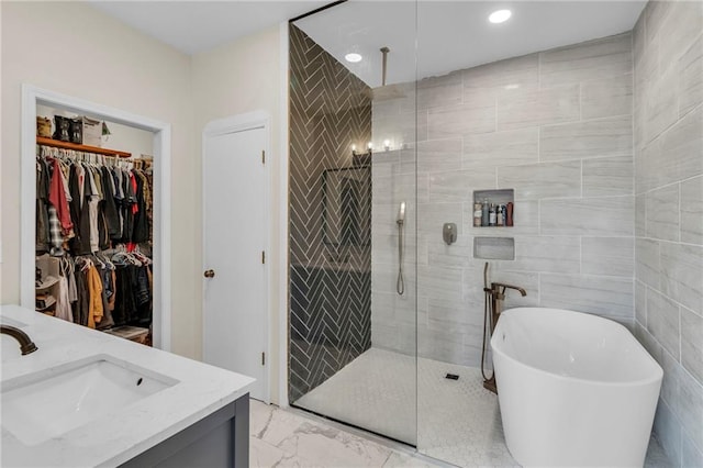 24101 S State Route K, Pleasant Hill, MO 64080 - full bathroom with a shower stall, a freestanding bath, marble look tile flooring, a spacious closet, and vanity