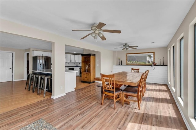 24101 S State Route K, Pleasant Hill, MO 64080 - dining space featuring light wood finished floors, a ceiling fan, and baseboards