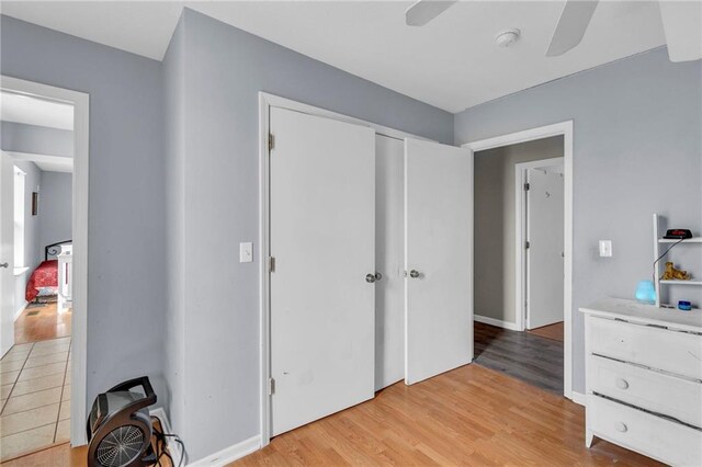 24101 S State Route K, Pleasant Hill, MO 64080 - bedroom featuring light wood finished floors, ceiling fan, and a closet